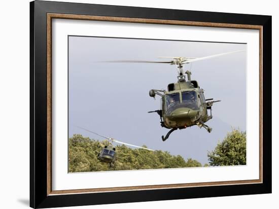 Two Italian Air Force Ab-212 Ico Helicopters Practice Low Level Flying-null-Framed Photographic Print