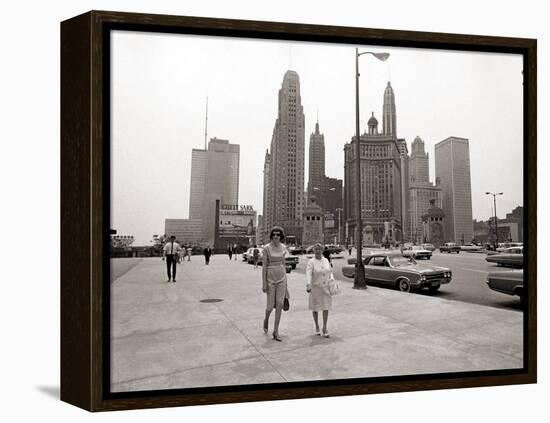 Two Ladies Walking the Sidewalk Skyscrapers in Chicago America's Windy City, in the 1960s-null-Framed Premier Image Canvas