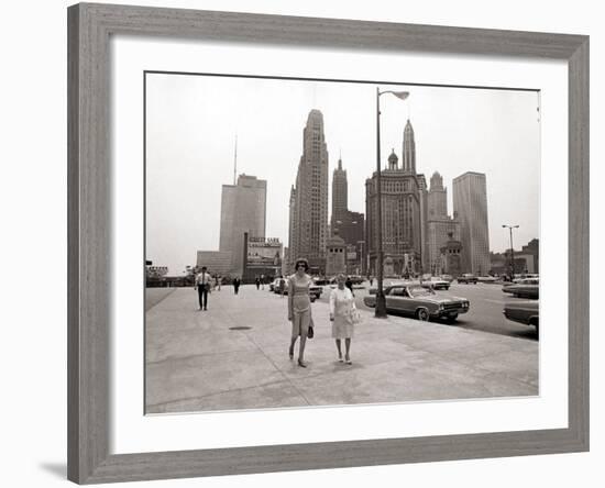 Two Ladies Walking the Sidewalk Skyscrapers in Chicago America's Windy City, in the 1960s-null-Framed Photographic Print