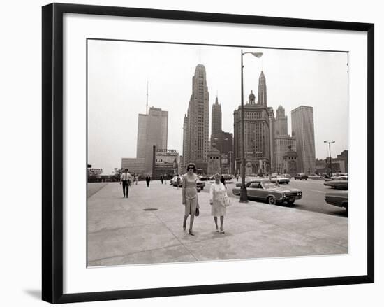 Two Ladies Walking the Sidewalk Skyscrapers in Chicago America's Windy City, in the 1960s-null-Framed Photographic Print