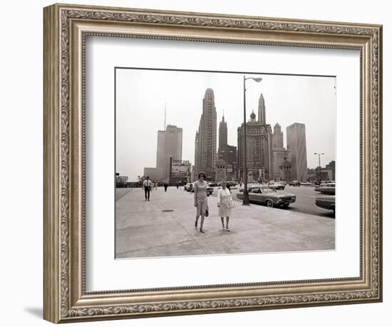 Two Ladies Walking the Sidewalk Skyscrapers in Chicago America's Windy City, in the 1960s-null-Framed Photographic Print