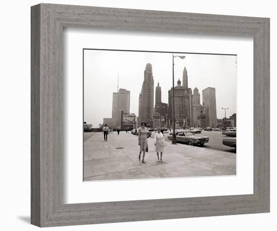 Two Ladies Walking the Sidewalk Skyscrapers in Chicago America's Windy City, in the 1960s-null-Framed Photographic Print