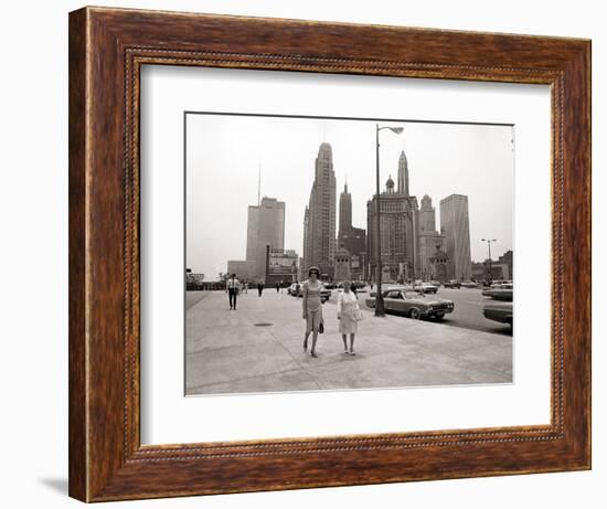 Two Ladies Walking the Sidewalk Skyscrapers in Chicago America's Windy City, in the 1960s-null-Framed Photographic Print