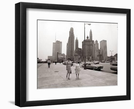 Two Ladies Walking the Sidewalk Skyscrapers in Chicago America's Windy City, in the 1960s-null-Framed Photographic Print