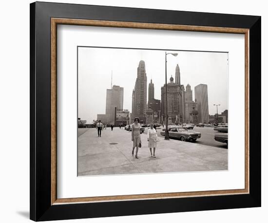 Two Ladies Walking the Sidewalk Skyscrapers in Chicago America's Windy City, in the 1960s-null-Framed Photographic Print