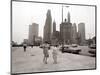 Two Ladies Walking the Sidewalk Skyscrapers in Chicago America's Windy City, in the 1960s-null-Mounted Photographic Print