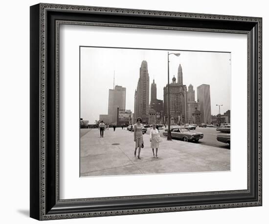 Two Ladies Walking the Sidewalk Skyscrapers in Chicago America's Windy City, in the 1960s-null-Framed Photographic Print