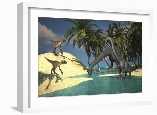 Two Large Brachiosaurus Grazing in Shallow Waters as Two Utahraptors Approach-null-Framed Art Print