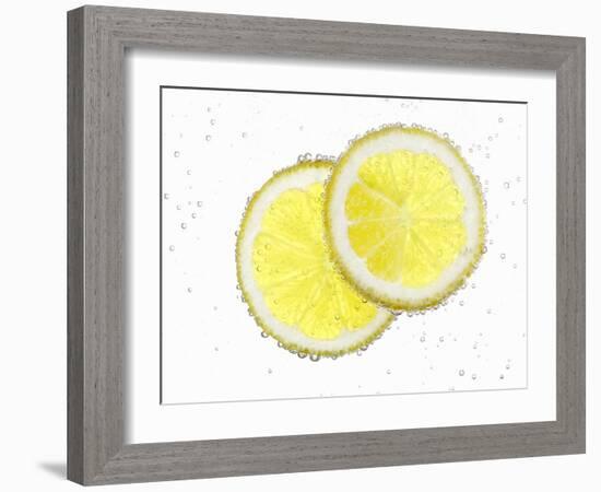 Two Lemon Slices in Water with Air Bubbles-Kröger & Gross-Framed Photographic Print