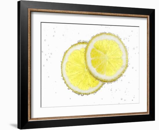 Two Lemon Slices in Water with Air Bubbles-Kröger & Gross-Framed Photographic Print