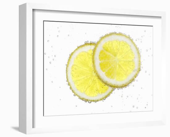 Two Lemon Slices in Water with Air Bubbles-Kröger & Gross-Framed Photographic Print