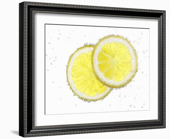 Two Lemon Slices in Water with Air Bubbles-Kröger & Gross-Framed Photographic Print