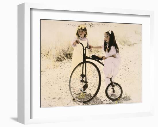 Two Little Girls by an Old Fashioned Bicycle-Nora Hernandez-Framed Giclee Print