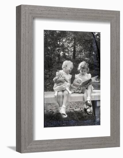 Two Little Girls Sitting on a Bench-Philip Gendreau-Framed Photographic Print