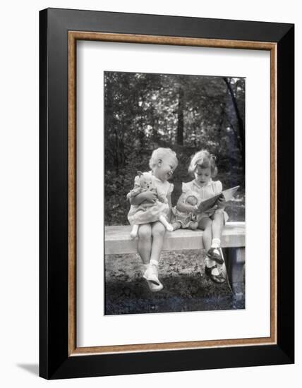 Two Little Girls Sitting on a Bench-Philip Gendreau-Framed Photographic Print