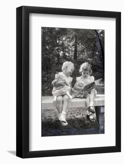 Two Little Girls Sitting on a Bench-Philip Gendreau-Framed Photographic Print