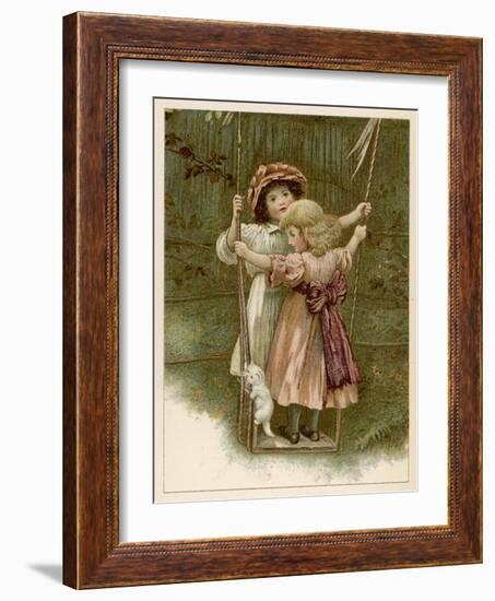 Two Little Girls Stand on a Swing with a White Kitten-null-Framed Art Print