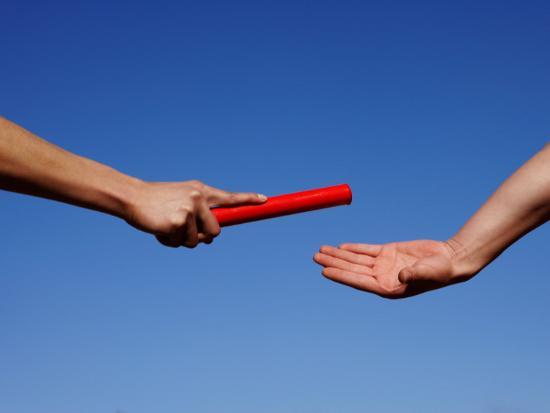 Two Male Runners Passing Relay Baton During Race, Close-Up ...