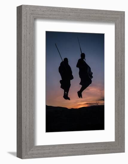 Two Masaai Warriors Silhouetted Performing Traditional Jump - Leap Kopje at Sunset-Nick Garbutt-Framed Photographic Print