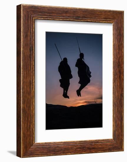 Two Masaai Warriors Silhouetted Performing Traditional Jump - Leap Kopje at Sunset-Nick Garbutt-Framed Photographic Print