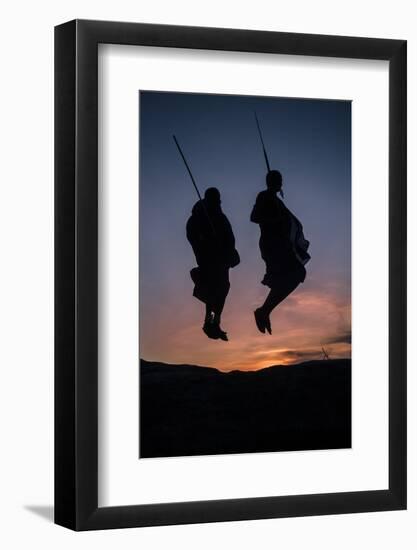 Two Masaai Warriors Silhouetted Performing Traditional Jump - Leap Kopje at Sunset-Nick Garbutt-Framed Photographic Print