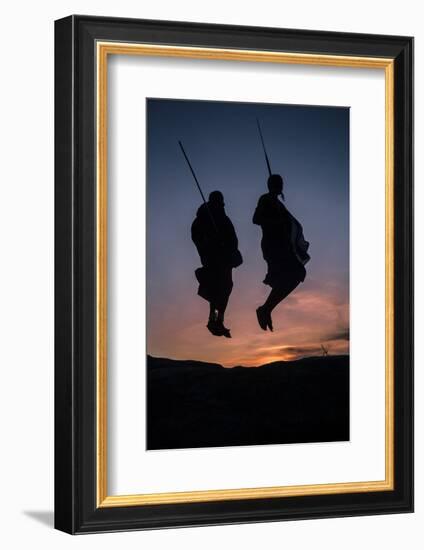 Two Masaai Warriors Silhouetted Performing Traditional Jump - Leap Kopje at Sunset-Nick Garbutt-Framed Photographic Print