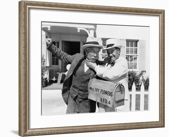 Two Mature Men Fighting Near a Mail Box in Front of a House-null-Framed Photo