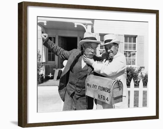 Two Mature Men Fighting Near a Mail Box in Front of a House-null-Framed Photo