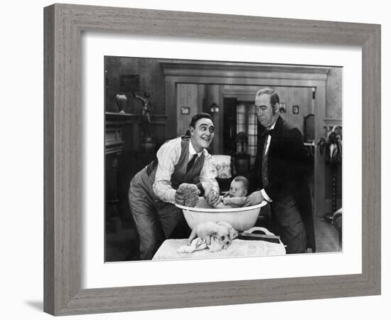 Two Men Giving a Baby a Bath-null-Framed Photo