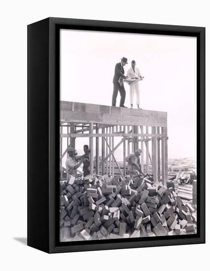 Two Men Going over Blueprints-null-Framed Stretched Canvas