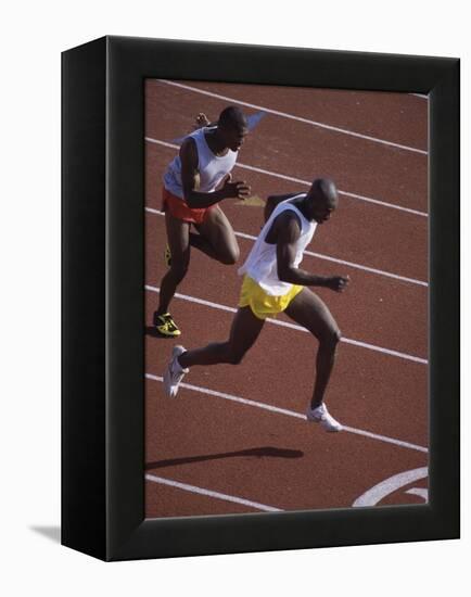 Two Men Racing on a Track-null-Framed Premier Image Canvas