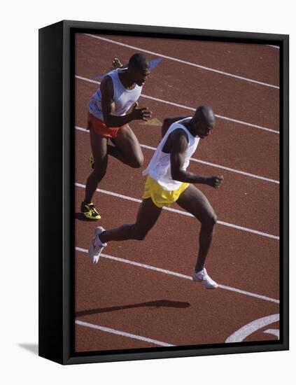 Two Men Racing on a Track-null-Framed Premier Image Canvas