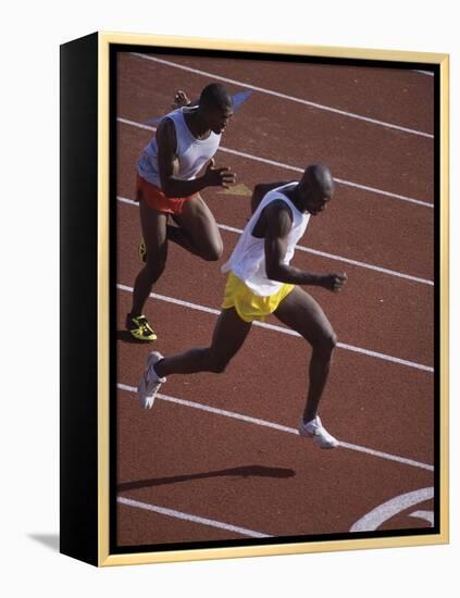 Two Men Racing on a Track-null-Framed Premier Image Canvas