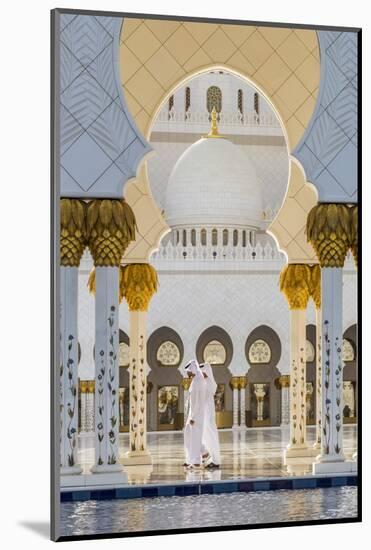 Two Middle Eastern men traditionally dressed walking in the courtyard of the Sheikh Zayed Mosque, A-Stefano Politi Markovina-Mounted Photographic Print