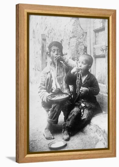 Two Neapolitan Children Slurp Down Spaghetti-null-Framed Stretched Canvas