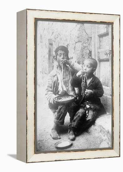 Two Neapolitan Children Slurp Down Spaghetti-null-Framed Stretched Canvas