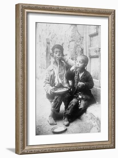 Two Neapolitan Children Slurp Down Spaghetti-null-Framed Art Print