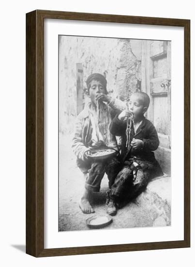 Two Neapolitan Children Slurp Down Spaghetti-null-Framed Art Print