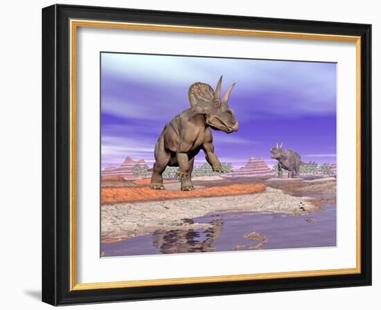 Two Nedoceratops Next to Water in a Colorful Rocky Landscape-null-Framed Art Print