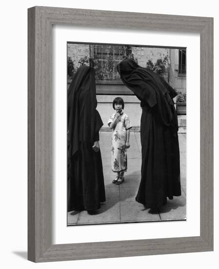 Two Nuns Questioning a Little Chinese Girl at the American Mission School-Alfred Eisenstaedt-Framed Photographic Print