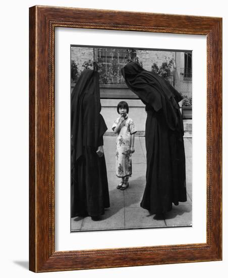 Two Nuns Questioning a Little Chinese Girl at the American Mission School-Alfred Eisenstaedt-Framed Photographic Print