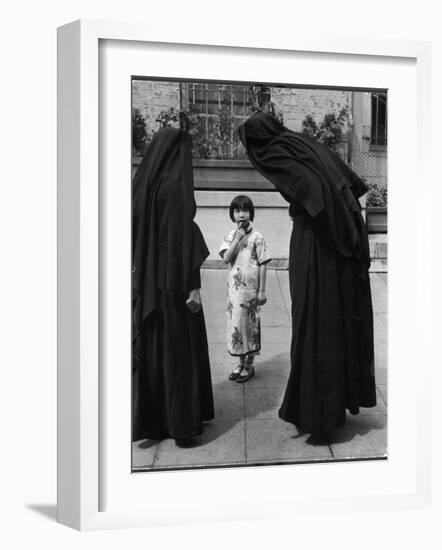 Two Nuns Questioning a Little Chinese Girl at the American Mission School-Alfred Eisenstaedt-Framed Photographic Print