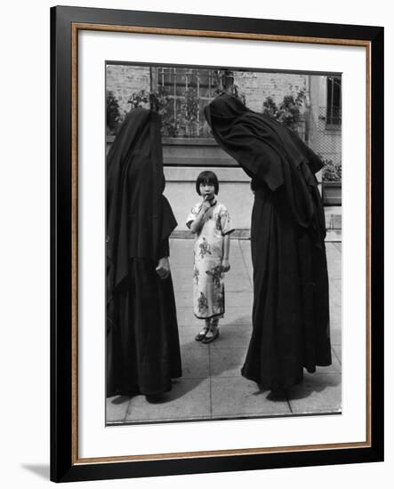 Two Nuns Questioning a Little Chinese Girl at the American Mission School-Alfred Eisenstaedt-Framed Photographic Print