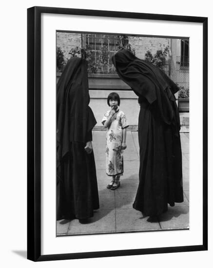 Two Nuns Questioning a Little Chinese Girl at the American Mission School-Alfred Eisenstaedt-Framed Photographic Print