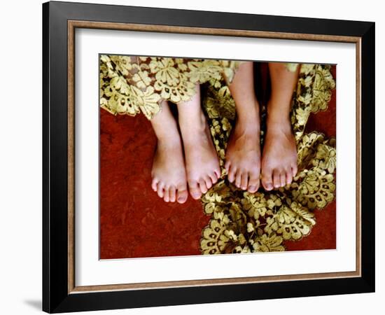 Two Pair of Feet of Small Children with Textile Spread around Them-Winfred Evers-Framed Photographic Print