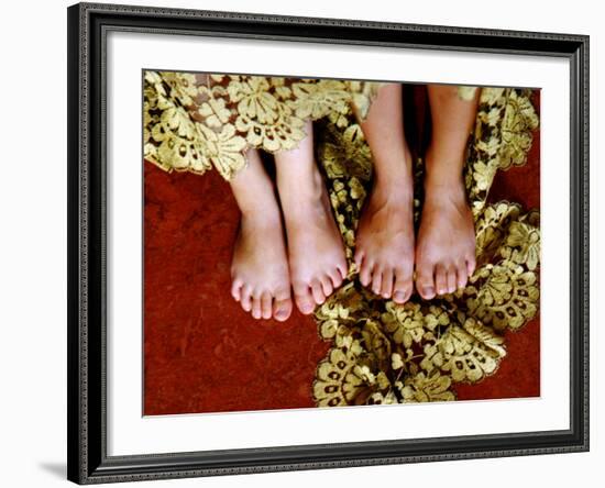 Two Pair of Feet of Small Children with Textile Spread around Them-Winfred Evers-Framed Photographic Print