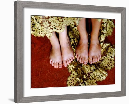 Two Pair of Feet of Small Children with Textile Spread around Them-Winfred Evers-Framed Photographic Print