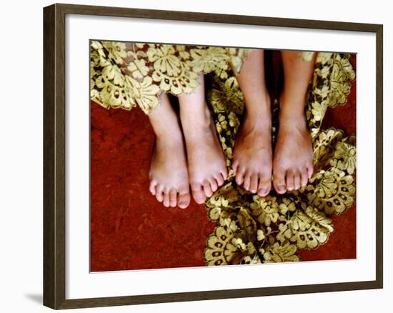 Two Pair of Feet of Small Children with Textile Spread around Them-Winfred Evers-Framed Photographic Print