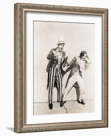 Two People in 18th Century Costumes Playing with Firecrackers-null-Framed Photo