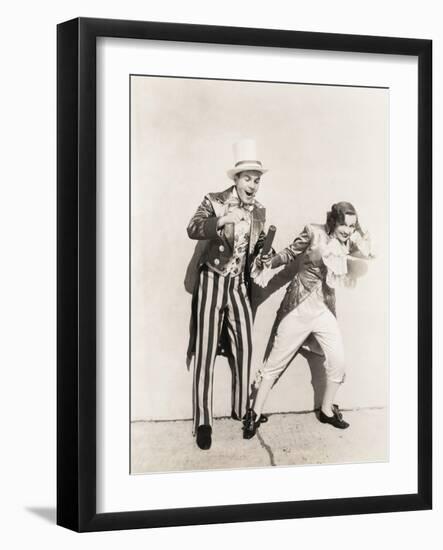 Two People in 18th Century Costumes Playing with Firecrackers-null-Framed Photo